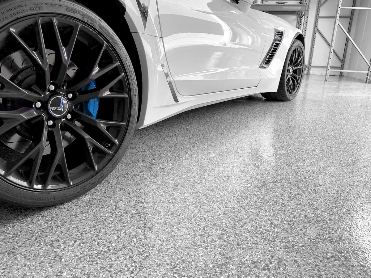 Sports car parked on a fresh Omega flake floor